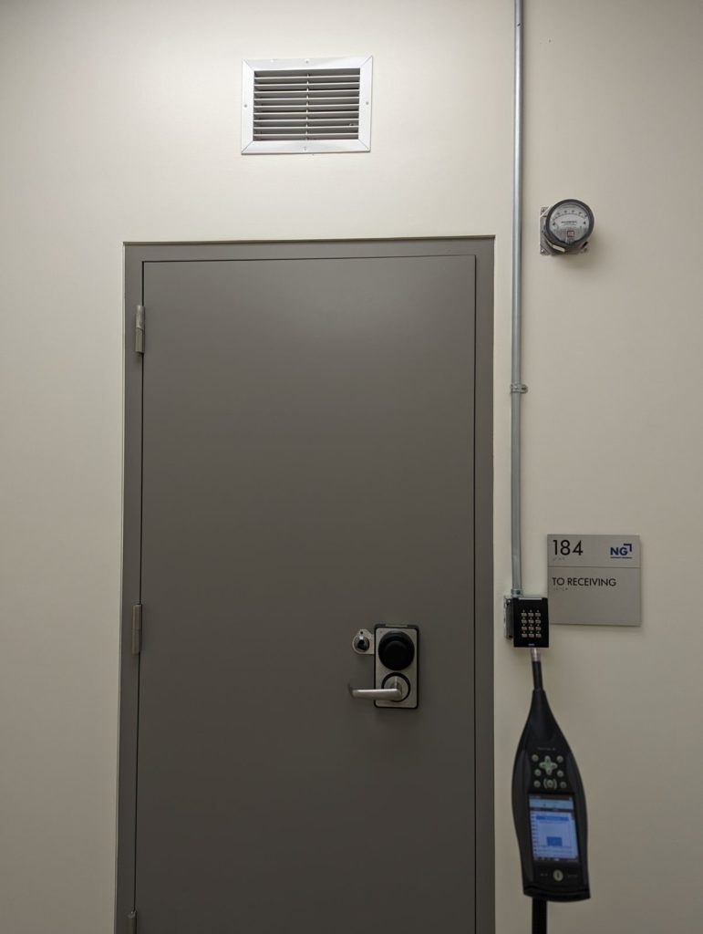 Acoustic measurement equipment positioned for door testing