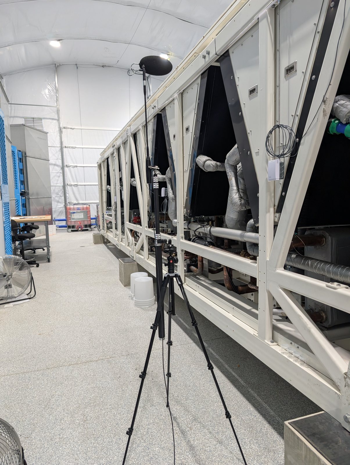 Noise measurement equipment positioned near HVAC chiller equipment